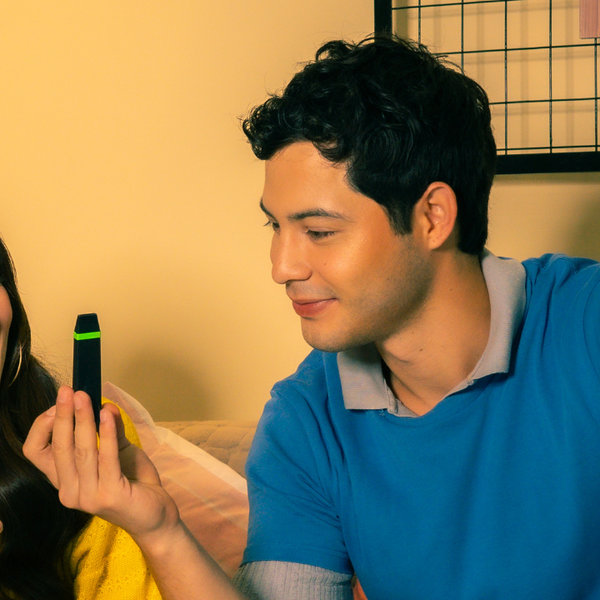 Man in blue shirt holding CAPNOS Zero